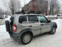 Багажник Уникар для ВАЗ-2123 Chevrolet Niva, LADA Niva Travel с боковым ограждением с сеткой на штатные места