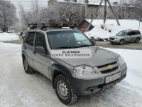Багажник Уникар для ВАЗ-2123 Chevrolet Niva, LADA Niva Travel с боковым ограждением с сеткой на штатные места