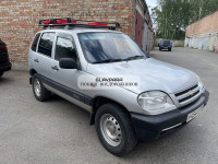 Багажник Уникар для ВАЗ-2123 Chevrolet Niva, LADA Niva Travel с боковым ограждением с сеткой на штатные места