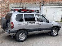 Багажник Уникар для ВАЗ-2123 Chevrolet Niva, LADA Niva Travel с боковым ограждением с сеткой на штатные места