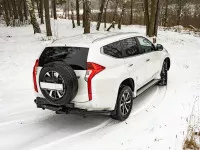Бампер РИФ задний силовой/защита штатного бампера Mitsubishi Pajero Sport 2015-2020 c квадратом под фаркоп, калиткой, подсветкой номера Бампер РИФ задний силовой/защита штатного бампера Mitsubishi Pajero Sport 2015-2020 c квадратом под фаркоп, калиткой, подсветкой номера