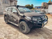 Бампер силовой передний РИФ для Mitsubishi Pajero Sport 2015+ с доп. фарами (арт. B0205), защитной дугой, защитой бачка омывателя, под парктроник
