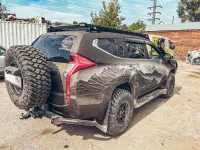 Бампер РИФ задний силовой/защита штатного бампера Mitsubishi Pajero Sport 2015-2020 c квадратом под фаркоп, калиткой, подсветкой номера Бампер РИФ задний силовой/защита штатного бампера Mitsubishi Pajero Sport 2015-2020 c квадратом под фаркоп, калиткой, подсветкой номера