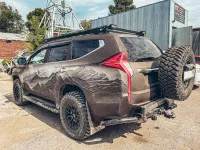 Бампер РИФ задний силовой/защита штатного бампера Mitsubishi Pajero Sport 2015-2020 c квадратом под фаркоп, калиткой, подсветкой номера Бампер РИФ задний силовой/защита штатного бампера Mitsubishi Pajero Sport 2015-2020 c квадратом под фаркоп, калиткой, подсветкой номера